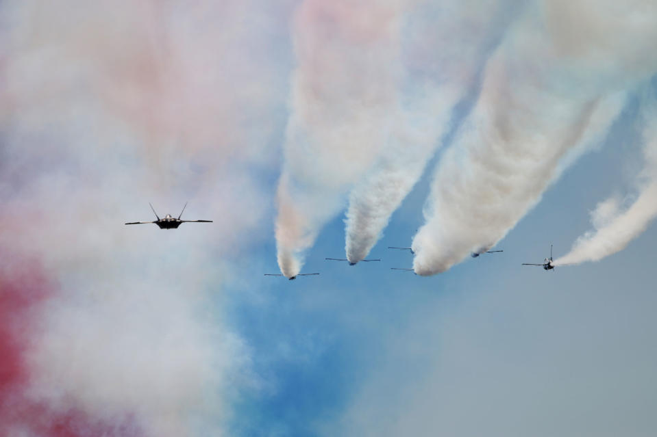 <p>French Alpha jets in a ‘Big Nine’ formation fly past during the annual Bastille Day parade in French capital Paris on July 14, 2017. (Photo: Zakaria Abdelkafi/AFP/Getty Images) </p>