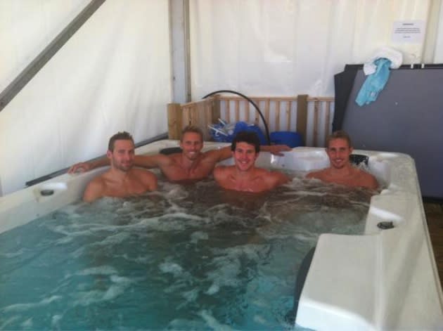 Graeme Moore and his South African swim 'bros' chill out in an ice bath — Twitter