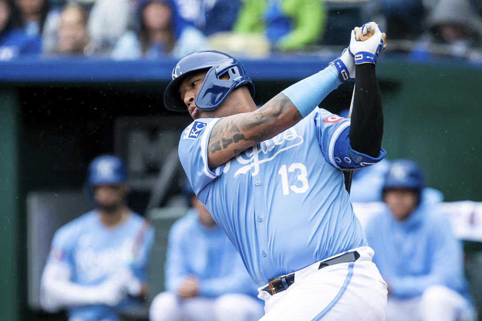 Kansas City Royals' catcher Salvador Perez takes a swing at the ball during the first inning of a baseball game against the Texas Rangers, Sunday, May 5, 2024, in Kansas City, Mo. (AP Photo/Nick Tre. Smith)