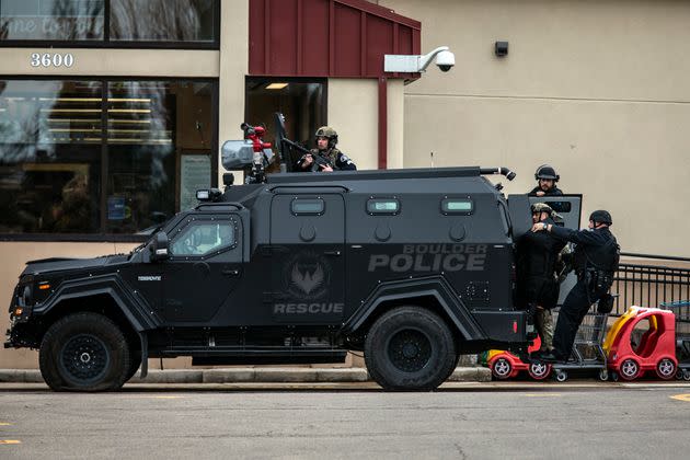 SWAT teams advance through a parking lot as a gunman opened fire at a King Sooper's grocery store on March 22, 2021 in Boulder, Colorado. Ten people, including a police officer, were killed in the attack.  (Photo: Chet Strange via Getty Images)