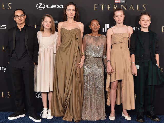 <p>Axelle/Bauer-Griffin/FilmMagic</p> Angelina Jolie, third from left, along with kids Maddox, Vivienne, Shiloh and Zahara in 2021