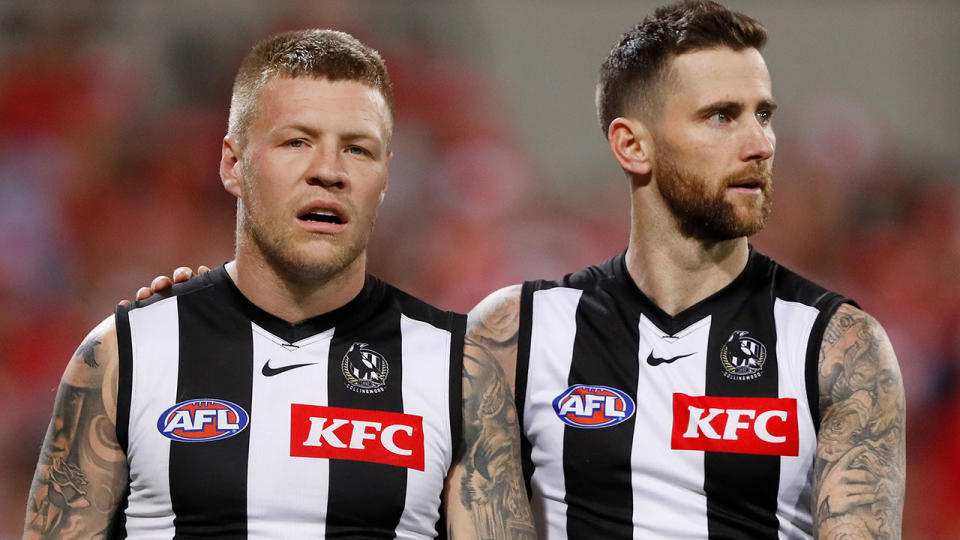 Jordan De Goey is pictured with Collingwood teammate Jeremy Howe.