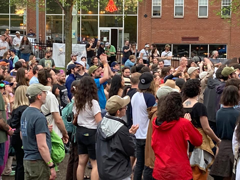 A crowd listens to a performance May 15, 2022 by Low Cut Connie at the Waking Windows festival in Winooski.