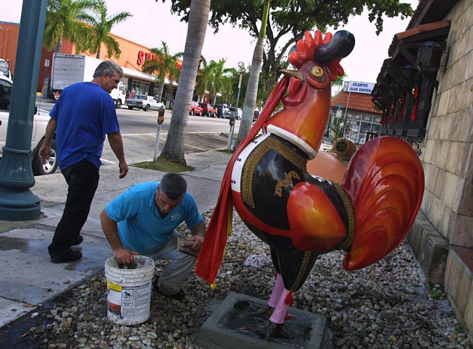 Andres M. Barral gives the final touches to a giant rooster sculpture in front of Casa Juancho restaurant on SW 8th Street in this 2002 photo. This rooster is one of several that are part of the Rooster Walk project created by artist Pedro Damian, and with the support of several local businesses and the city of Miami.