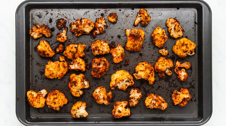 Roasted cauliflower on baking sheet