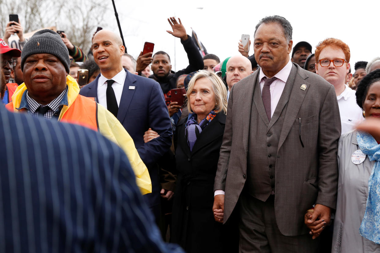 Democratic 2020 U.S. presidential candidate and U.S. Senator Cory Booker (D-NJ), Former Secretary of State Hillary Rodham Clinton, and Rev. Jesse Jackson march across the Edmund Pettus Bridge during the Bloody Sunday commemorative march in Selma, Alabama, March 3, 2019. (Photo: Chris Aluka Berry/Reuters)