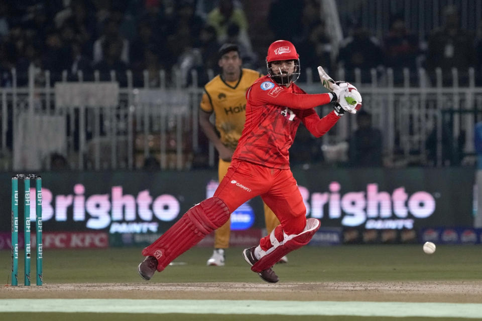 Islamabad United' Shadab Khan plays a shot during the Pakistan Super League T20 cricket match between Islamabad United and Peshawar Zalmi, in Rawalpindi, Pakistan, Monday, March 4, 2024. (AP Photo/Anjum Naveed)