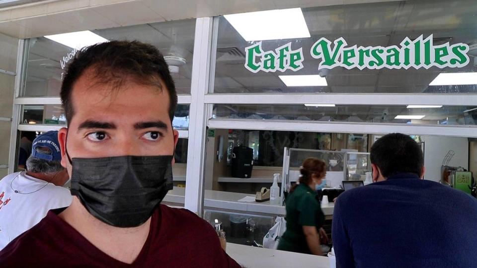 Avi Vizoso, a Miami Dade College student, drinks Cuban coffee at Versailles restaurant in Miami on Saturday, April 17, 2021.