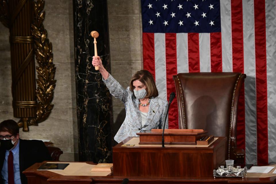 US Speaker of the House Nancy Pelosi wields the Speaker's gavel after being re-elected as Speaker and preparing to swear in members of the 117th House of Representatives in Washington, DC on January 3, 2021.