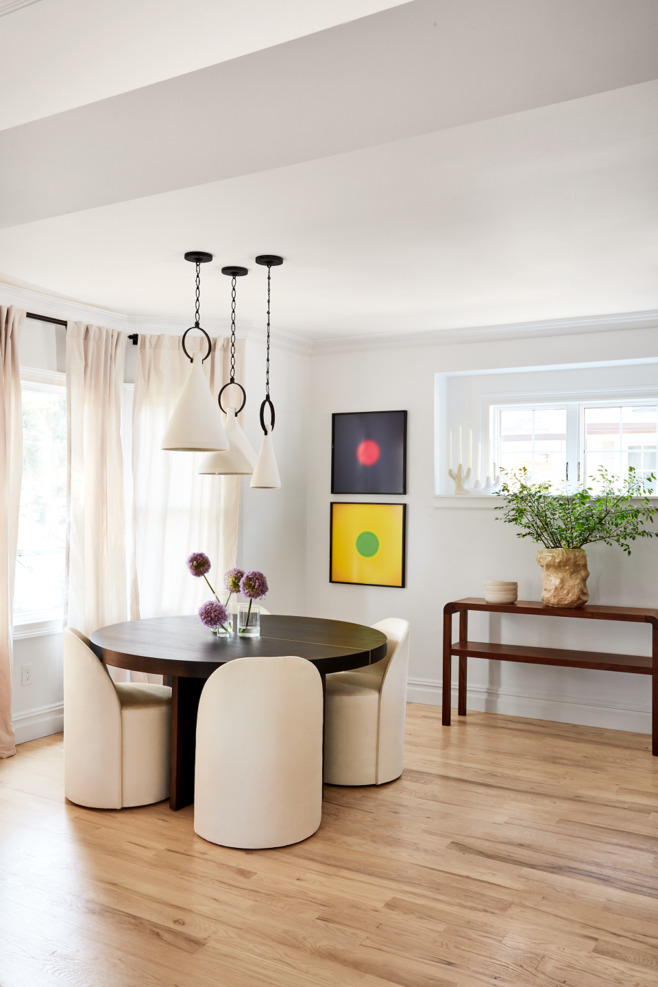 Dining table with pendant lights overhead