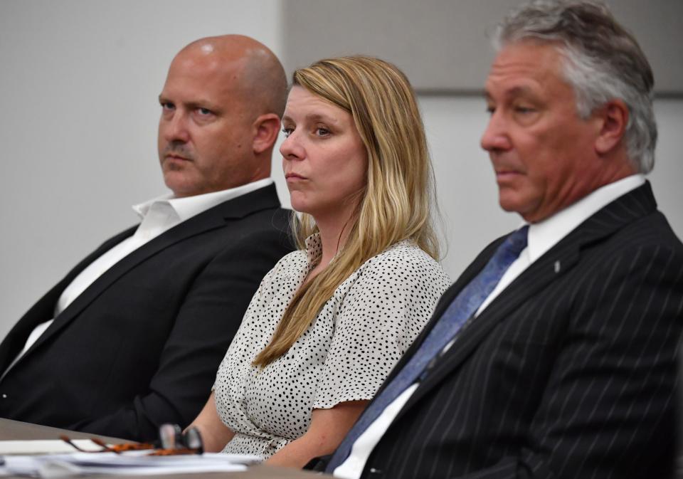 Gabby Petito's parents, Joseph Petito, left, and Nichole Schmidt, center, with their attorney, Patrick Reilly, right, listen to arguments by an attorney for Brian Laundrie's parents, Matthew Luka, as Luka seeks to have a negligence lawsuit dismissed in court in Sarasota County, Florida on Wednesday, June 22, 2022. Petito and Schmidt claim in their lawsuit that the Laundries acted maliciously by not telling them where their daughter was and if she was alive.