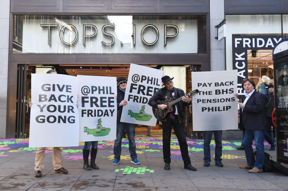 Protesters let by musician Homesick Mick (third right) outside Topshop in Oxford Circus, London, demonstrate against Sir Philip Green in a campaign called #phillipfreefriday asking shoppers on Black Friday to boycott his stores in an effort to persuade the billionaire to pay the lost BHS pensions back to his former staff.