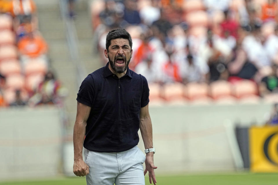 Houston Dynamo coach Paulo Nagamura yells at the officials during the second half of a MLS soccer match against Austin FC Saturday, April 30, 2022, in Houston. Austin FC won 2-1. (AP Photo/David J. Phillip)