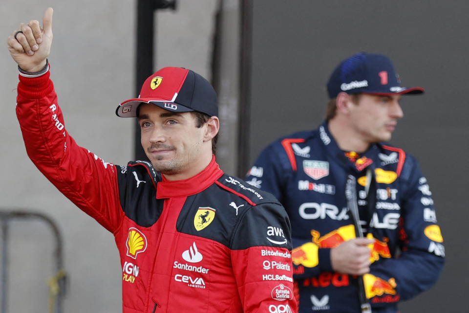 Ferrari's Monegasque driver Charles Leclerc (L) celebrates winning the pole position after the qualifying session for the Formula One Mexico Grand Prix at the Hermanos Rodriguez racetrack in Mexico City on October 28, 2023. (Photo by ANDRES STAPFF / AFP) (Photo by ANDRES STAPFF/AFP via Getty Images)