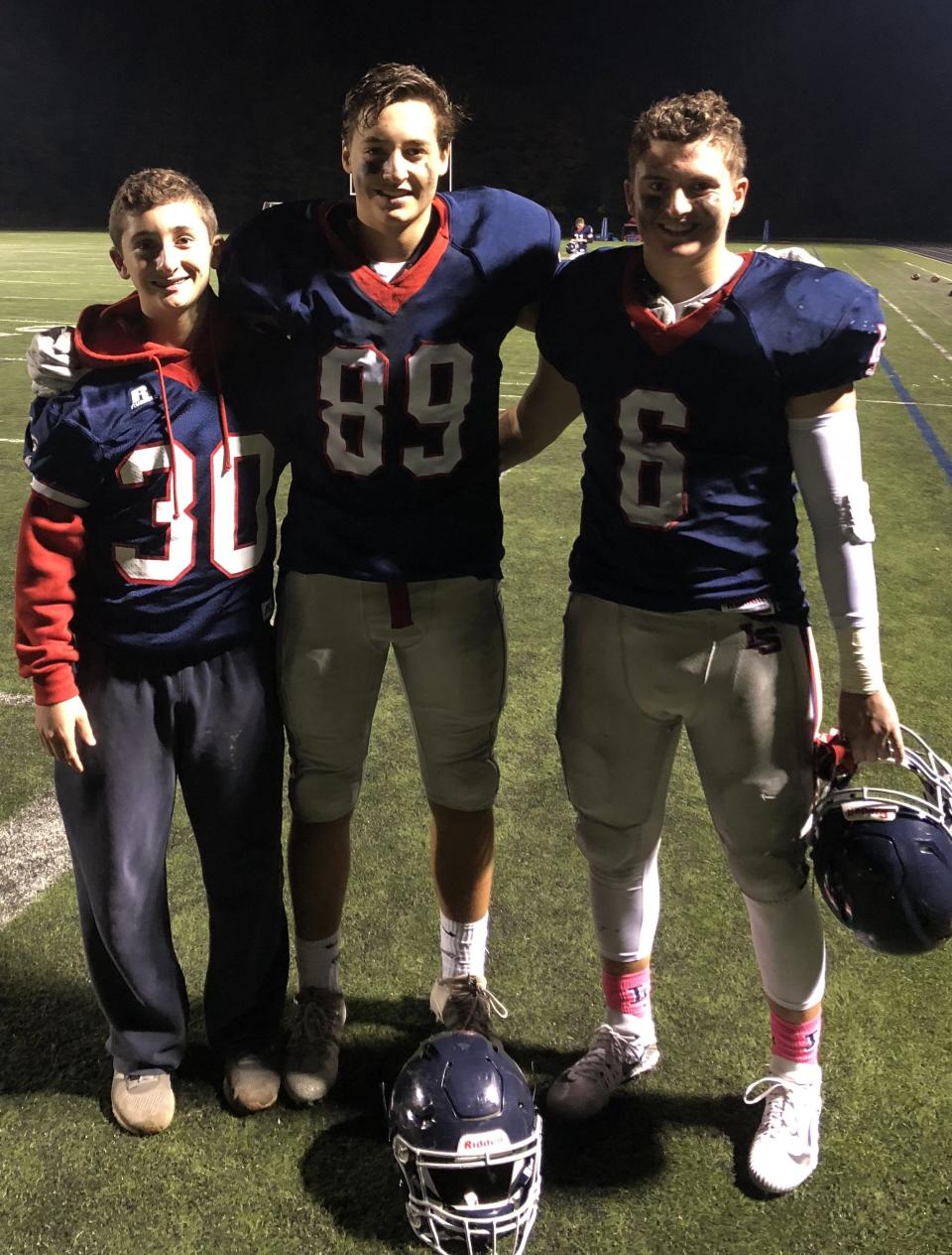 Brothers Luke Ohler, from left, Will Ohler and Ben Ohler have all served as captains for Lincoln'Sudbury.
