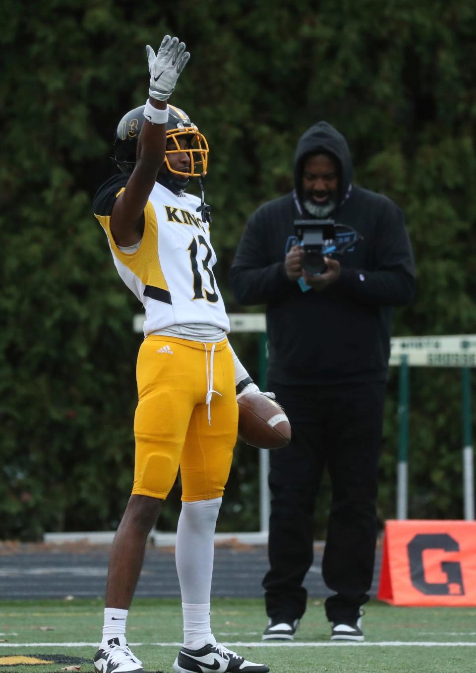 Detroit King reciever Ka'von Matthews celebrates his touchdown against Grosse Pointe North at Grosse Pointe North High School on Friday, Nov. 3, 2023.