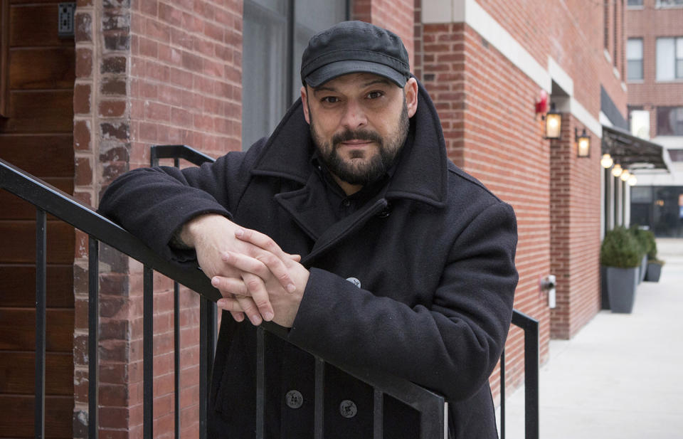 <p>Christian Picciolini, founder of the group Life After Hate, poses for a photograph outside his Chicago home, Jan. 9, 2017. Picciolini, a former skinhead, is an activist combatting what many see as a surge in white nationalism across the United States. He’s doing it by helping members quit groups including the Ku Klux Klan and skinhead organizations. (Photo: Teresa Crawford/AP) </p>