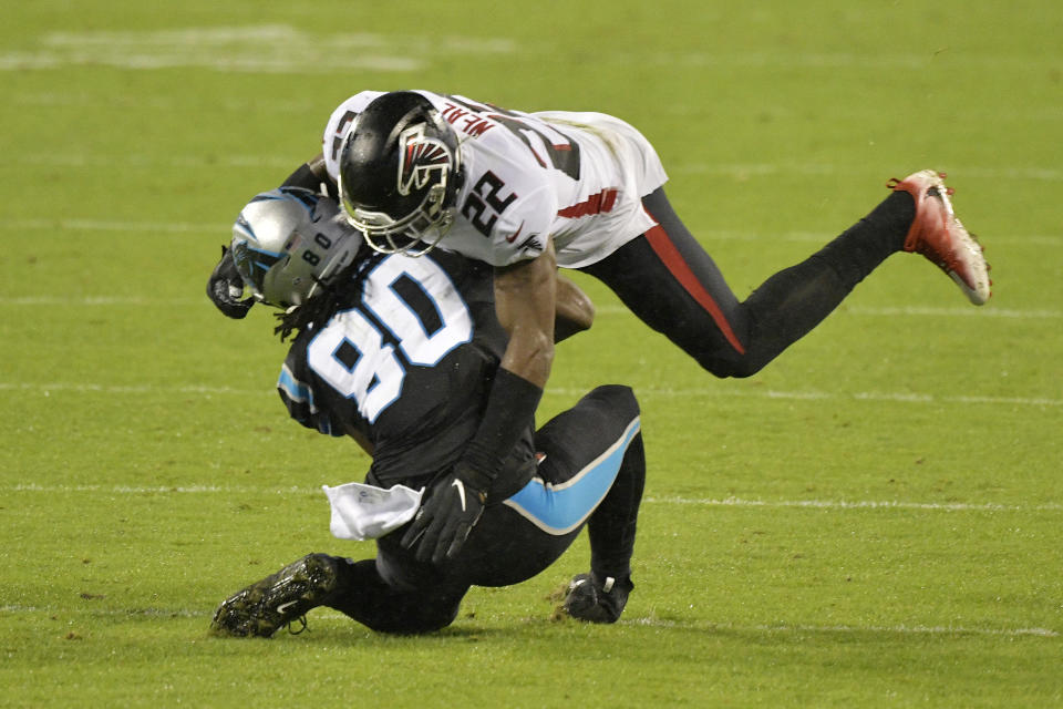 Ian Thomas of the Carolina Panthers is hit by Keanu Neal of the Atlanta Falcons. (Photo by Grant Halverson/Getty Images)