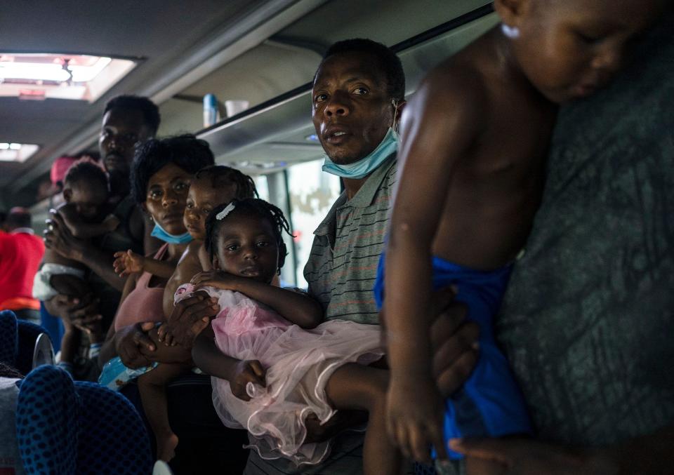 Haitian migrants remain on a bus as they refuse to get out of the vehicle after being detained by agents of the National Migration Institute (INM) at a migration checkpoint in Veracruz, Mexico, on September 13, 2021. - More than 200 migrants were detained in the state of Veracruz on their way north, according to figures provided by the National Institute of Migration (INM). (Photo by VICTORIA RAZO / AFP) (Photo by VICTORIA RAZO/AFP via Getty Images) ORG XMIT: 0 ORIG FILE ID: AFP_9MT4CG.jpg