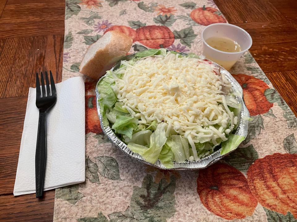 A double Italian tossed salad with cheese is served at Luigi's Restaurant in Akron.