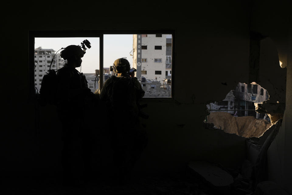 Israeli soldiers take position during a ground operation in the Gaza Strip, Wednesday, Nov. 8, 2023. Israeli ground forces entered the Gaza Strip as they press ahead with their war against Hamas militants in retaliation for the group's unprecedented Oct. 7 attack on Israel. (AP Photo/Ohad Zwigenberg)