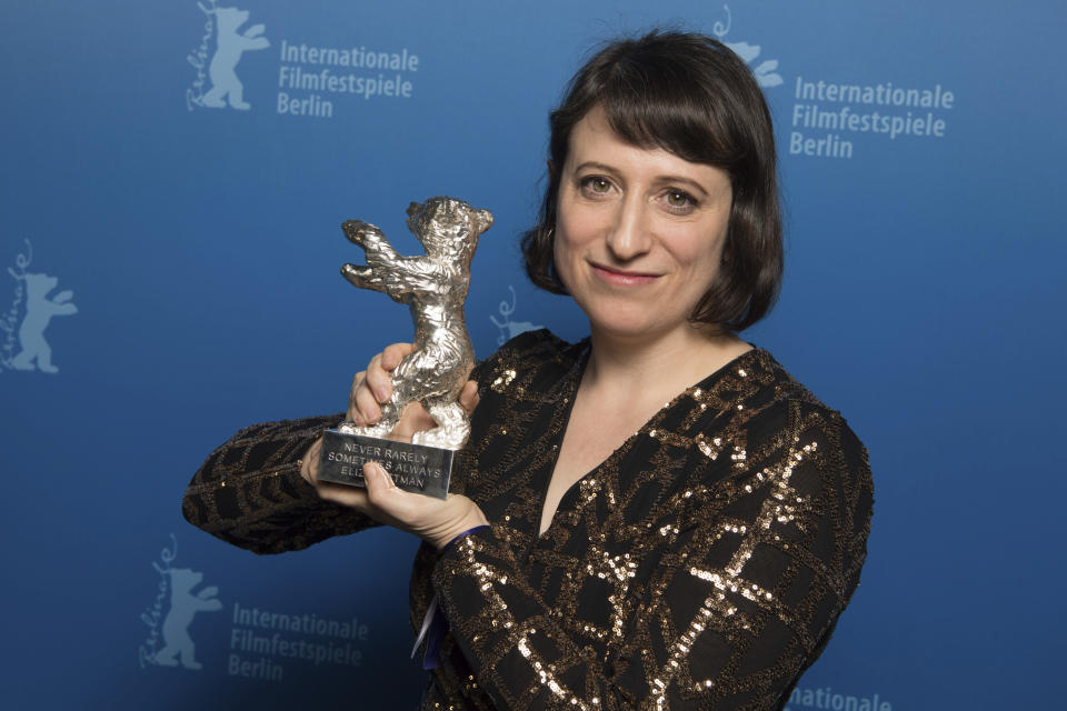 FILE - In this Feb. 29, 2020 file photo, writer-director Eliza Hittman holds The Silver Bear Grand Jury Prize for her film "Never Rarely Sometimes Always" after the award ceremony at the 70th International Berlinale Film Festival in Berlin, Germany. The film also took the top prize at the Sundance Film Festival. (Joerg Carstensen/DPA via AP, Pool)