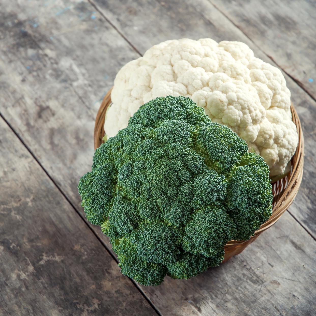 broccoli and cauliflower on old wooden table