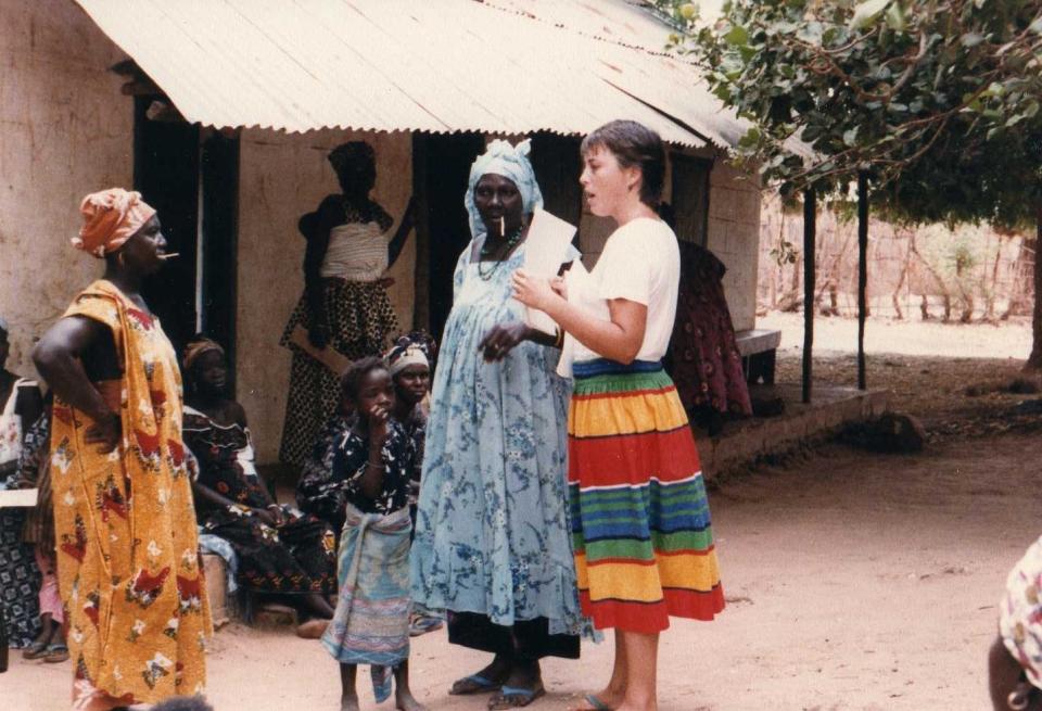 Jamie Rhein, right, giving a health talk with a traditional birth attendant at a village in N'Jowara, The Gambia, located in West Africa. Rhein served in the Peace Corps from 1982-1984.