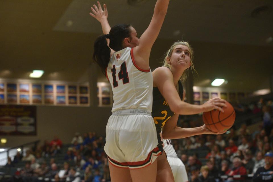 Wolsey-Wessington center Mallory Miller looks for an angle against Viborg-Hurley's Denae Mach at the Hanson girls basketball Classic Saturday, Jan. 14 in the Corn Palace.