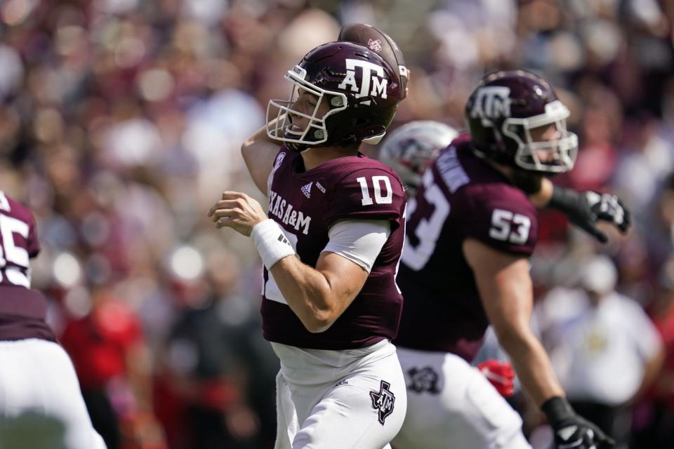 Texas A&M quarterback Zach Calzada passes down field against New Mexico.