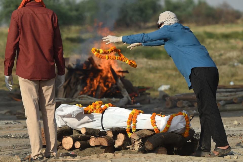 <div class="inline-image__caption"><p>Relatives perform the last rites before a cremation in Allahabad.</p></div> <div class="inline-image__credit">Sanjay Kanojia/AFP via Getty</div>