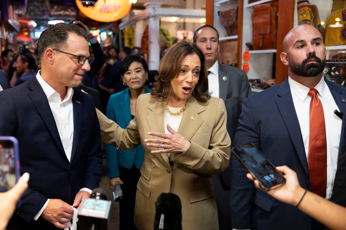 Vice President Kamala Harris and Pennsylvania Governor Josh Shapiro (L) speak to the press while making a stop at the Reading Terminal Market in Philadelphia, Pennsylvania, July 13, 2024.  ((Photo by RYAN COLLERD / AFP) (Photo by RYAN COLLERD/AFP via Getty Images))