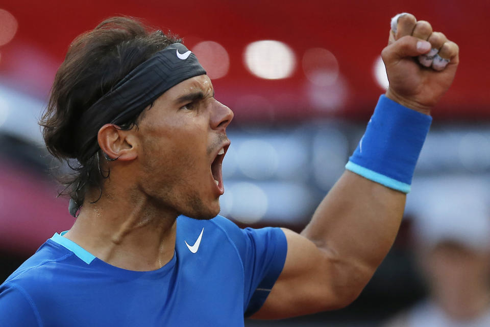 Rafael Nadal from Spain celebrates a point during a Madrid Open tennis tournament final match against Kei Nishikori from Japan in Madrid, Spain, Sunday, May 11, 2014. (AP Photo/Andres Kudacki)