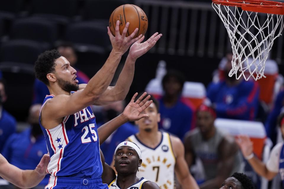 Philadelphia 76ers' Ben Simmons (25) shoots during the first half of an NBA basketball game against the Indiana Pacers, Friday, Dec. 18, 2020, in Indianapolis. (AP Photo/Darron Cummings)