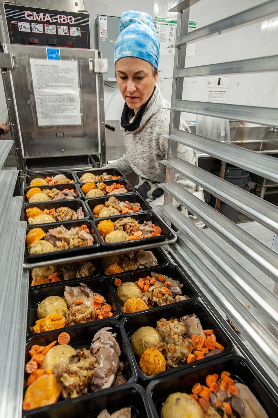 Beth Dergarabedian was part of the assembly line at Open Table in Maynard that prepared 500 Thanksgiving meals on Nov. 13.