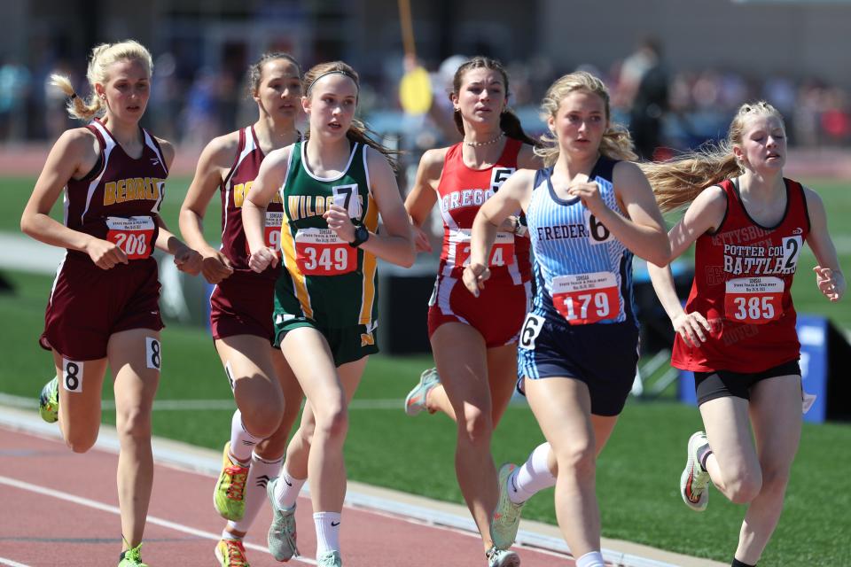 Runners compete in the third heat of the Class A girls 800-meter finals Friday at the South Dakota high school state track and field meet at Howard Wood Field in Sioux Falls.