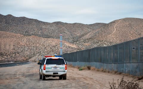 A U.S. Border Patrol agent patrols Sunland Park along the U.S.-Mexico border - Credit: AP
