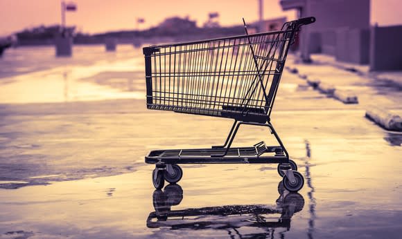 An empty shopping cart in an empty parking lot