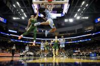 Marquette's Sean Jones shoots past Baylor's Keyonte George during the first half of an NCAA college basketball game Tuesday, Nov. 29, 2022, in Milwaukee. (AP Photo/Morry Gash)