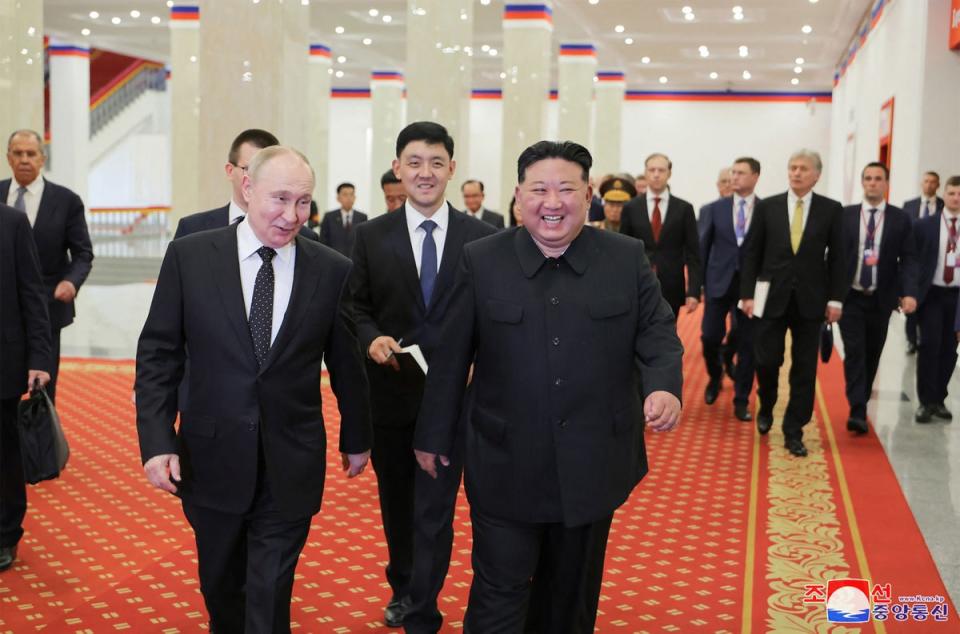 North Korea’s leader Kim Jong-un and Russia’s president Vladimir Putin speaking after watching the welcome performance at the Pyongyang Gymnasium in Pyongyang. (KCNA VIA KNS/AFP via Getty Image)