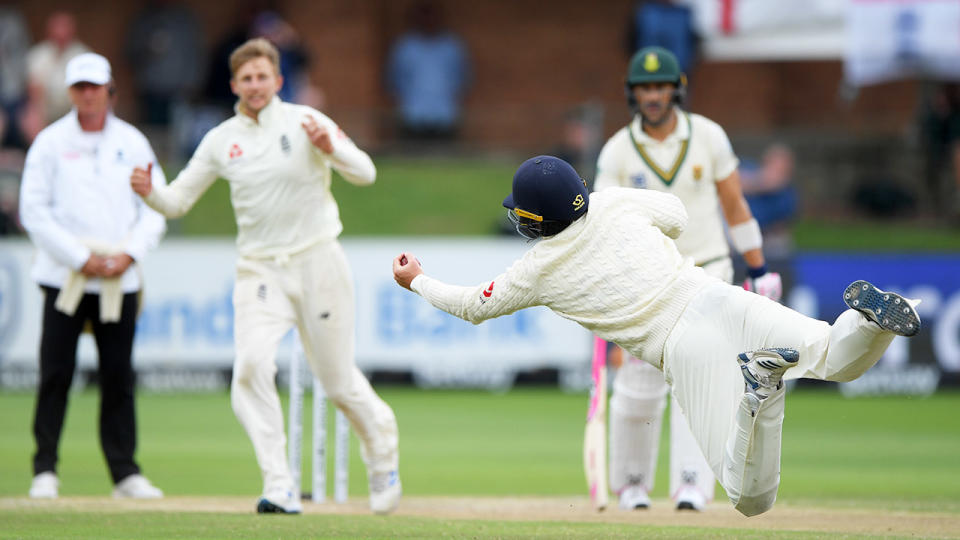 Ollie Pope, pictured here diving to catch Rassie van der Dussen as Joe Root looks on.