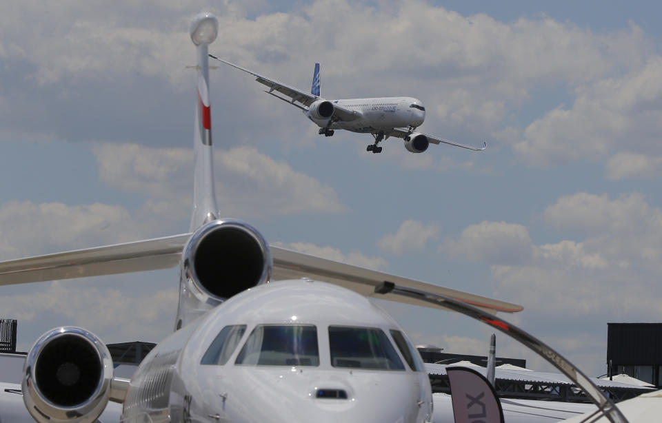 An Airbus A 350 - 1000 performs his demonstration flight at Paris Air Show, in Le Bourget, east of Paris, France, Monday, June 17, 2019. The world's aviation elite are gathering at the Paris Air Show with safety concerns on many minds after two crashes of the popular Boeing 737 Max. (AP Photo/Michel Euler)