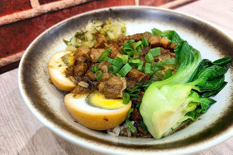The classic 'lǔ ròu fàn' or braised pork rice.