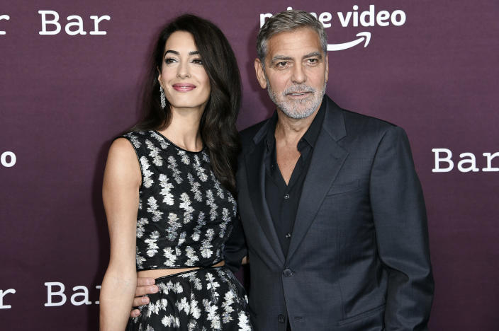 Amal Clooney, left, and George Clooney arrive at a screening of "The Tender Bar" on Sunday, Oct. 3, 2021, at the Directors Guild of America in Los Angeles. (Photo by Richard Shotwell/Invision/AP)