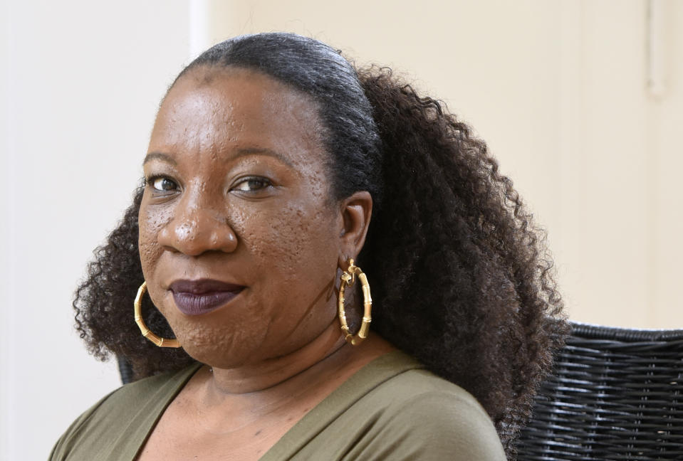 FILE - Tarana Burke, founder and leader of the #MeToo movement, sits in her home in Baltimore on Tuesday, Oct. 13, 2020. (AP Photo/Steve Ruark, File)