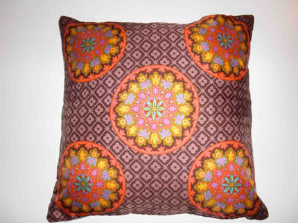 Buy a scarf pillow, like this Mod Floral Medallion Scarf Pillow ($25), or create one out of twoâ€¦