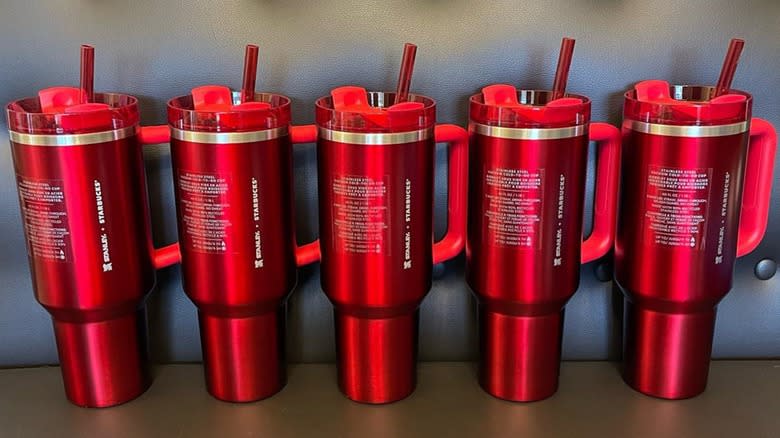 Five Starbucks x Stanley red holiday tumblers