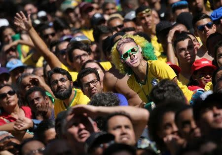 Soccer Football - World Cup - Round of 16 - Brazil vs Mexico - Sao Paulo, Brazil - July 2, 2018 - Fans react during the broadcast of the FIFA World Cup soccer match. REUTERS/Paulo Whitaker