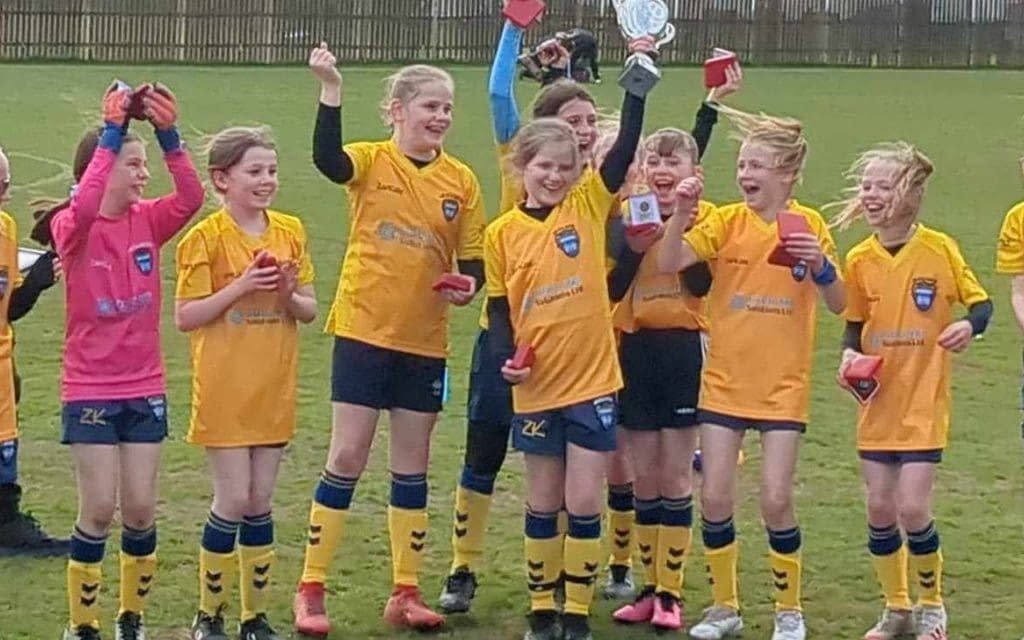 The team from Woodlanders FC won the Huddersfield Junior Football League Vase trophy