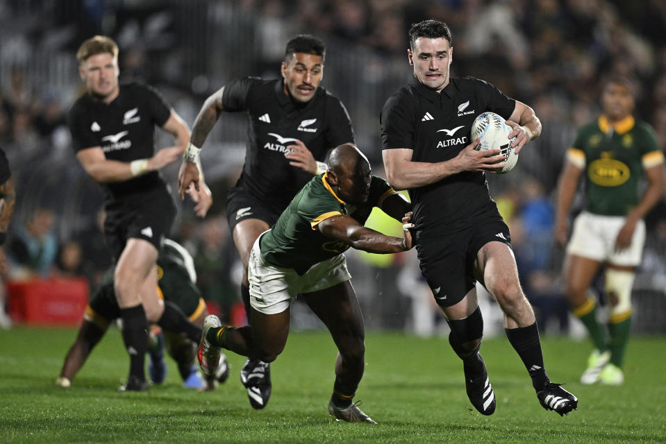 New Zealand's Will Jordan runs past a defender during the Rugby Championship test match between the All Blacks and South Africa at Mt Smart Stadium in Auckland, New Zealand, Saturday, July 15, 2023. ( Alan Lee/Photosport via AP)